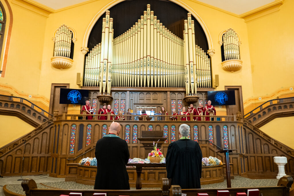 Rev Bobby Burtt Rev Jeff Jackson and the AkronFCC Chancel Choir with Stained Glass Panels